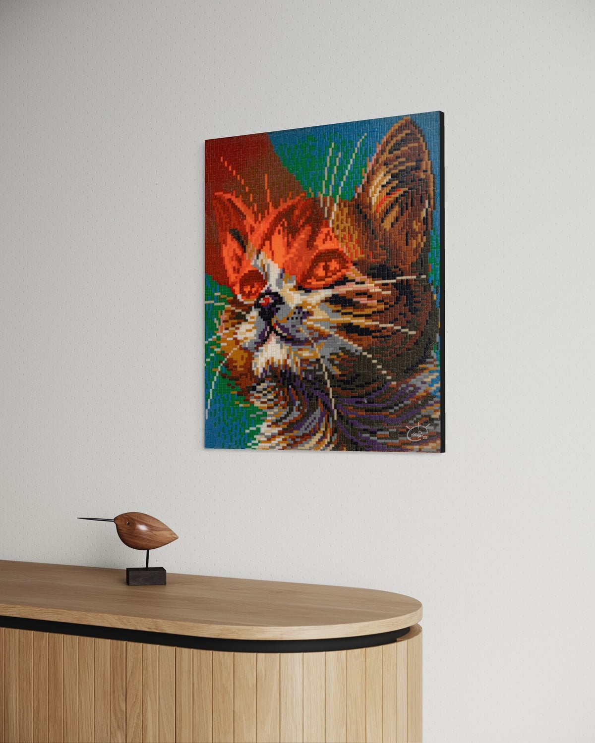 Side view of "LASER CAT" pixel art canvas hanging in a minimalistic room, highlighting the intricate pixel texture and the vibrant color palette of the cat's face.