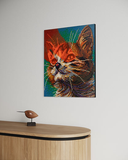 Side view of "LASER CAT" pixel art canvas hanging in a minimalistic room, highlighting the intricate pixel texture and the vibrant color palette of the cat's face.
