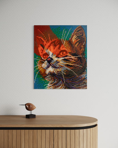 "LASER CAT" pixel art canvas displayed on a modern wall, showing the bold, colorful cat portrait in a stylish interior setting.