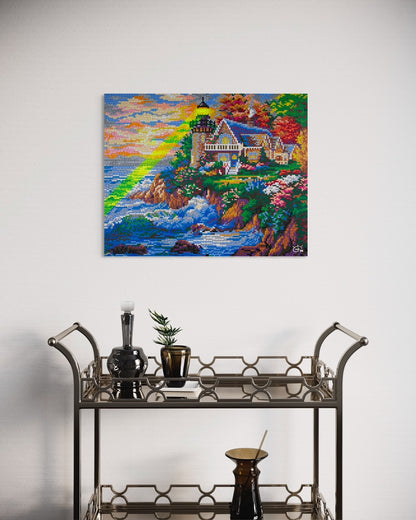 A vibrant pixel art canvas of a lighthouse with a green laser beam, displayed in a modern interior. The artwork showcases a scenic coastal landscape with a colorful sky and ocean waves.